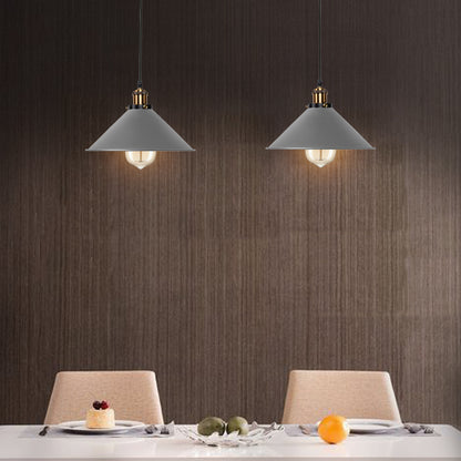 Grey pendant light hanging above a dining table